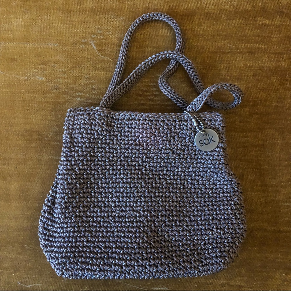 Brand new super sweet The Sak crocheted handbag with one inside zipper pocket